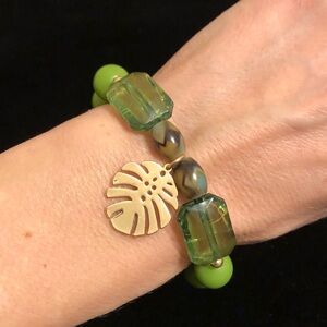 Green and Gold Tone Beaded Bracelet With Leaf Charm